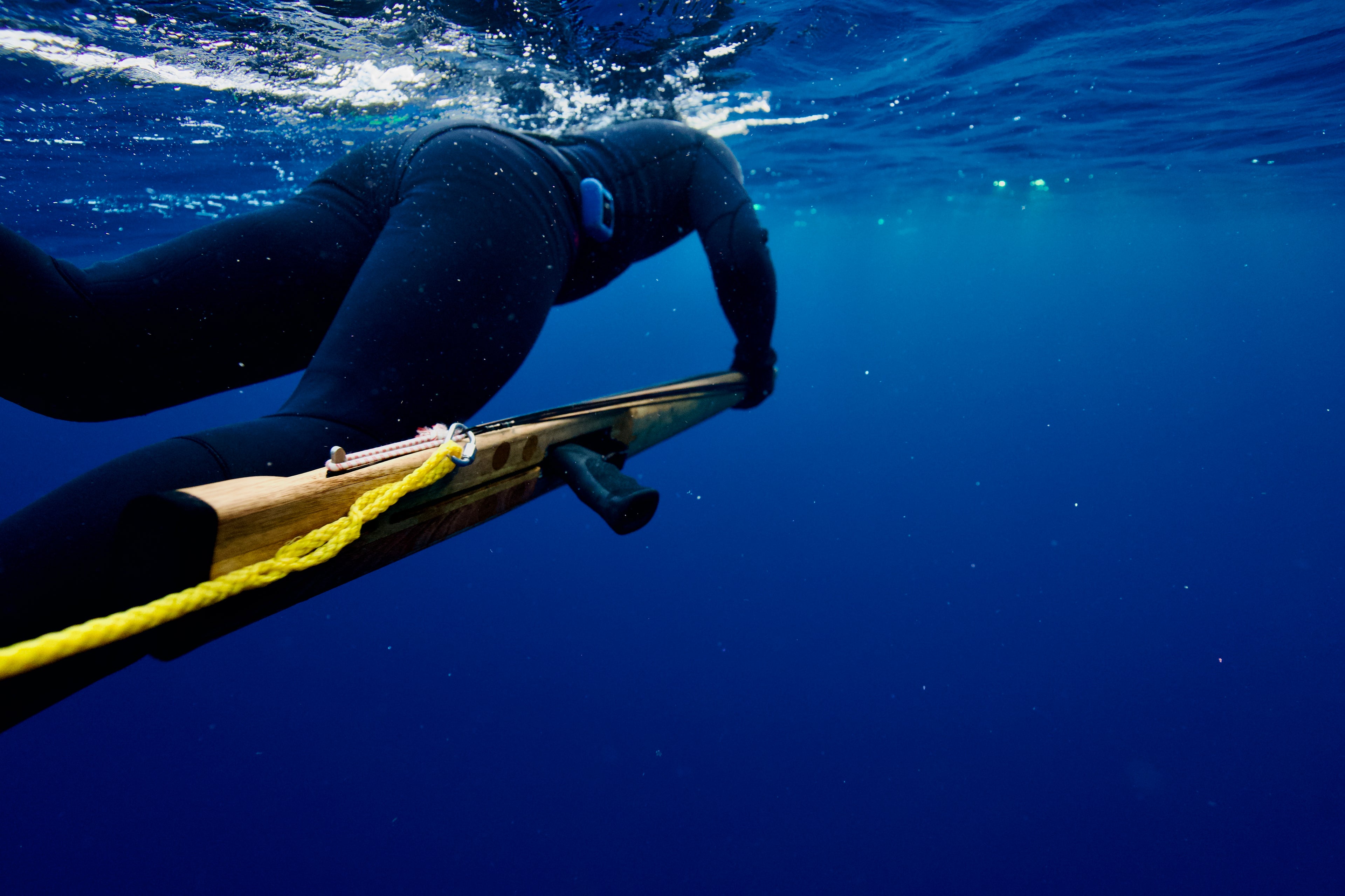 Pat swimming with Bombora 140MH Speargun in bluewater off NSW