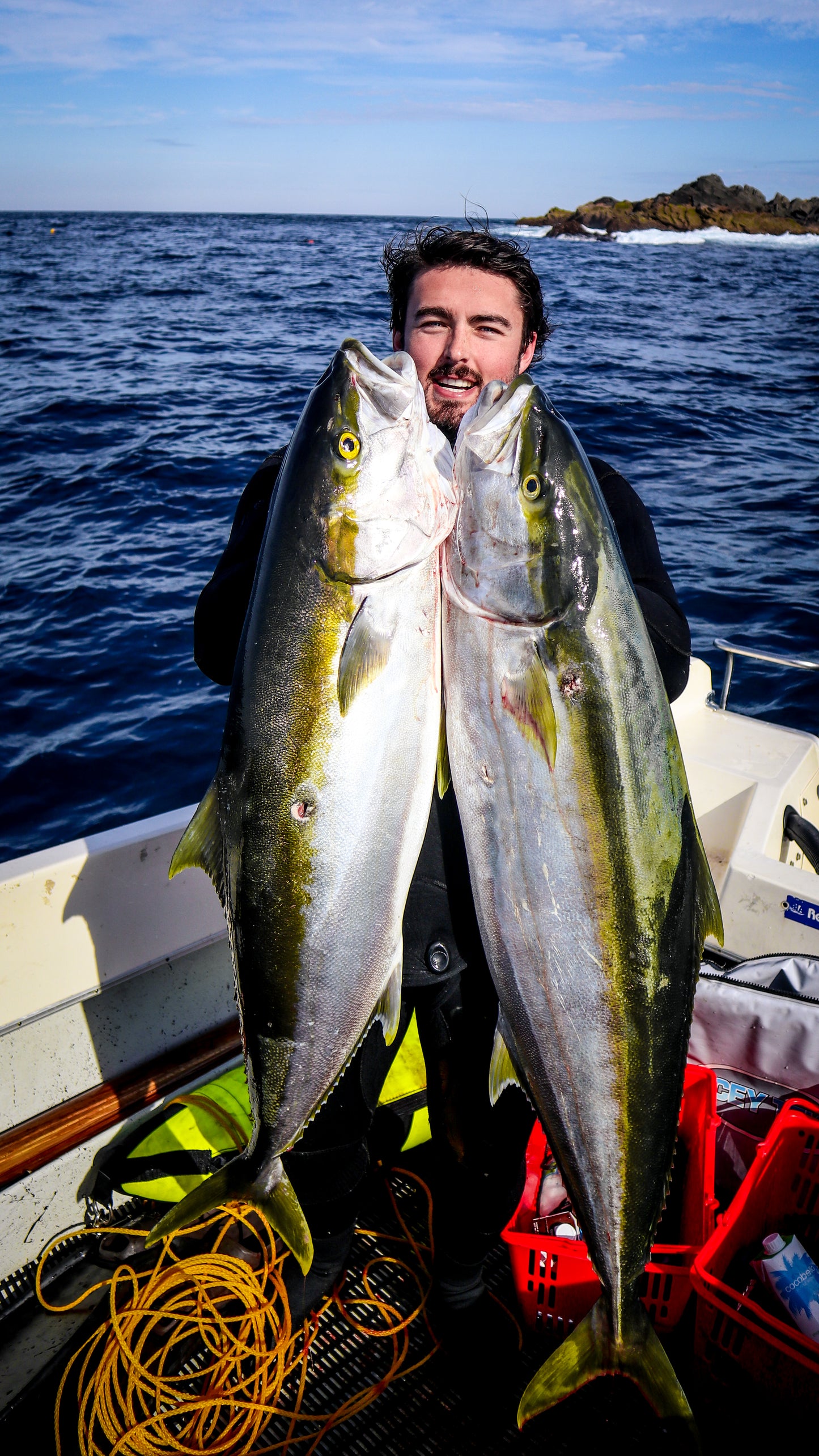 Pat holding to large yellowtail kingfish taken with the Bombora Pelagic 130RH Speargun